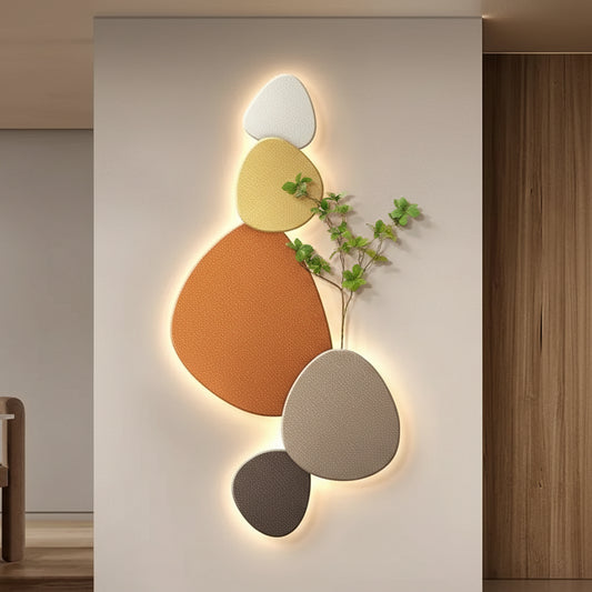 Modern wall art with geometric shapes and lighting in a room setting