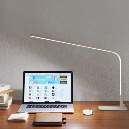 Compact desk lamp suitable for home offices, bedrooms, and study spaces